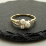 Geel gouden ring met parel en diamant
