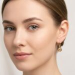 Gouden oorbellen met balletjes