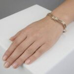 Gouden bicolor slavenarmband golvend model