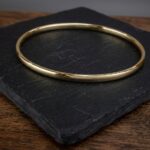Christian slavenarmband geel goud