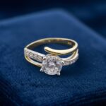 Christian bicolor gouden twist ring met zirkonia