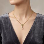 Gouden ketting met parel en smaragd hanger