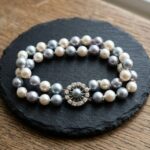 Parel armband met gouden slot met diamant