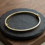 Geel gouden Christian slavenarmband