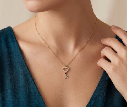 Gouden ketting en zirkonia harten sleutelhanger