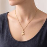 Gouden collier met teddybeer hanger