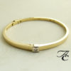 Gouden slavenarmband met briljant