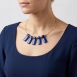 Gouden spang met glazen hangers