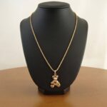 Gouden collier met teddybeer hanger