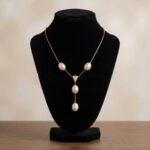 Gouden collier met parels en diamant