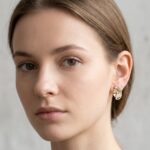Gouden fantasie oorbellen met diamant