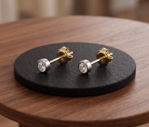 Gouden bicolor diamanten oorstekers
