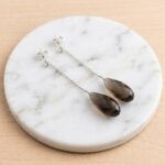 Gouden oorbellen met rookkwarts