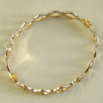 14 karaat geel- en wit gouden slavenarmband