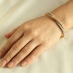 14 karaat geel-, wit en rosé gouden armband met zirkonia