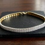 14 karaat geel- en wit gouden armband met zirkonia