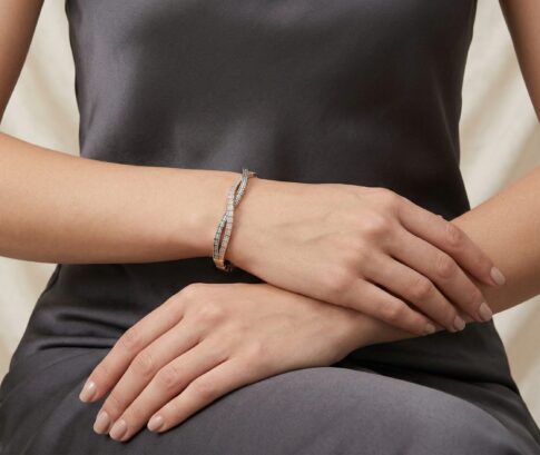 14 karaat geel-, wit en rosé gouden armband met zirkonia