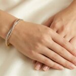14 karaat geel-, wit en rosé gouden armband met zirkonia