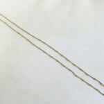 Gouden collier met balletjes