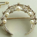 Bicolor broche met parels en diamanten