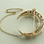 Bicolor broche met parels en diamanten