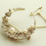 Bicolor broche met parels en diamanten