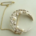 Bicolor broche met parels en diamanten