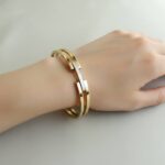 Christian gouden slavenarmband