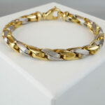 Christian armband bicolor goud