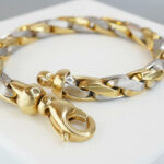 Christian armband bicolor goud