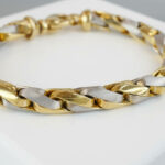 Christian armband bicolor goud