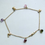 Gouden enkelband met bedels