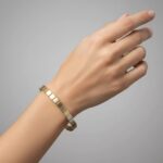 Gouden bicolor Christian schakelarmband