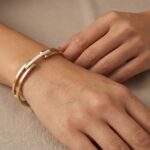 Christian gouden slavenarmband