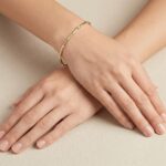 Bicolor Christian gouden schakelarmband