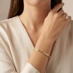 Gouden bicolor Christian schakelarmband