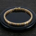 Gouden bicolor Christian schakelarmband