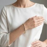 Bicolor Christian gouden schakelarmband