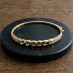 Christian gouden slavenarmband met zirkonia