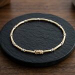 Bicolor Christian gouden schakelarmband