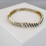 14 karaat gouden armband diamant en saffier