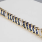 14 karaat gouden armband diamant en saffier