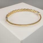 Geel gouden zirkonia schakelarmband