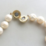 Parel collier met gouden slot