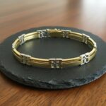 Christian bicolor gouden schakelarmband