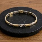 Gouden bicolor schakelarmband