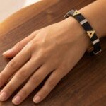 Rubberen en bicolor gouden armband