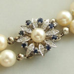 Parel armband met saffier en diamanten slot