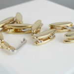 Dubbelzijdige bicolor gouden scharnierarmband