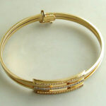 Gouden Christian slavenarmband met zirkonia